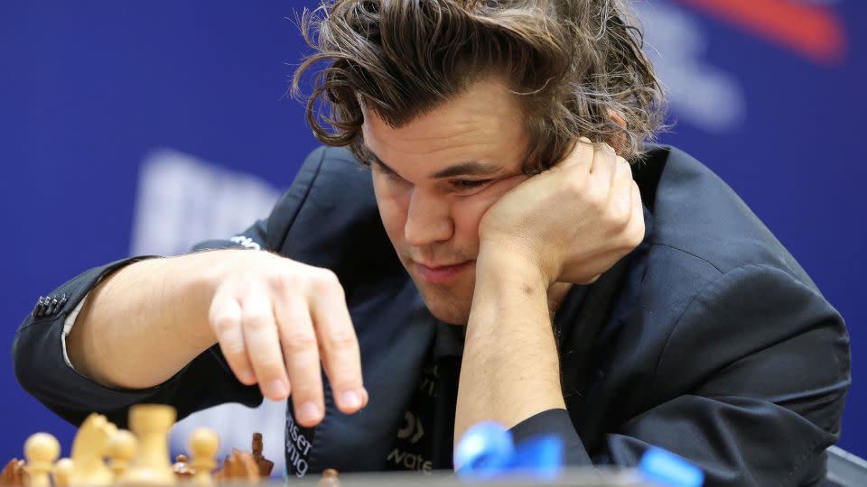 Carlsen ponders his next move during a match at the 2022 FIDE World Rapid and Blitz Championships. - Pavel Mikheyev/Reuters