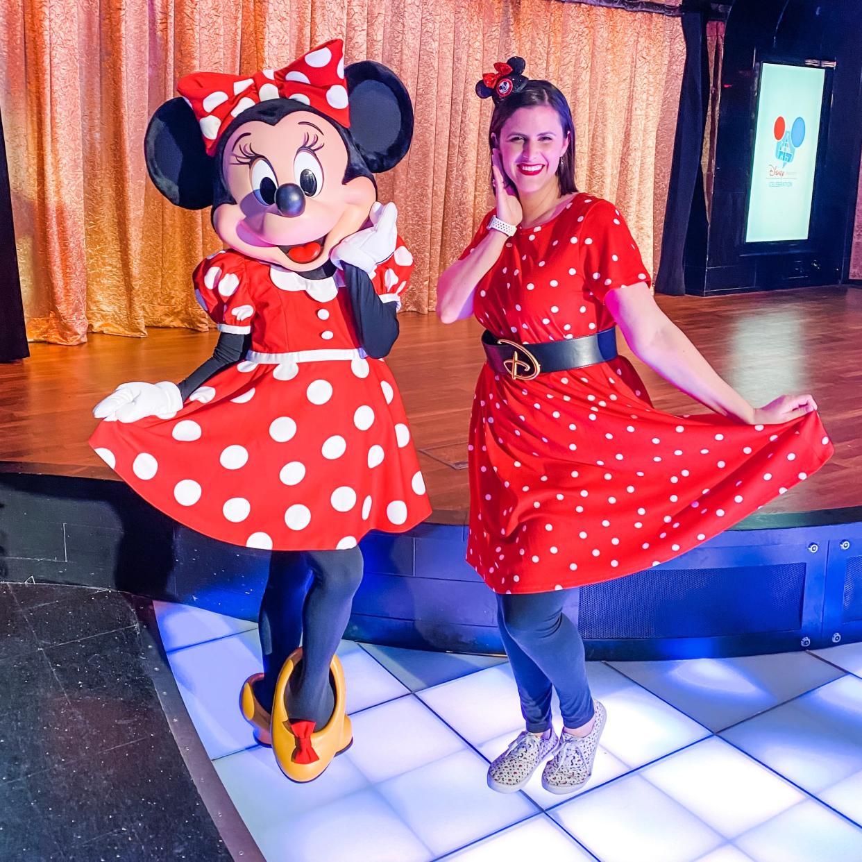 the writer posing with minnie mouse 