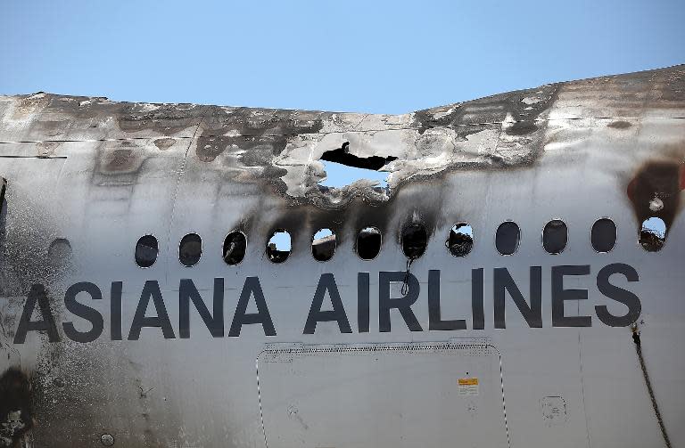 The wrecked fuselage of Asiana Airlines flght 214 sits in a storage area at San Francisco International Airport on July 12, 2013