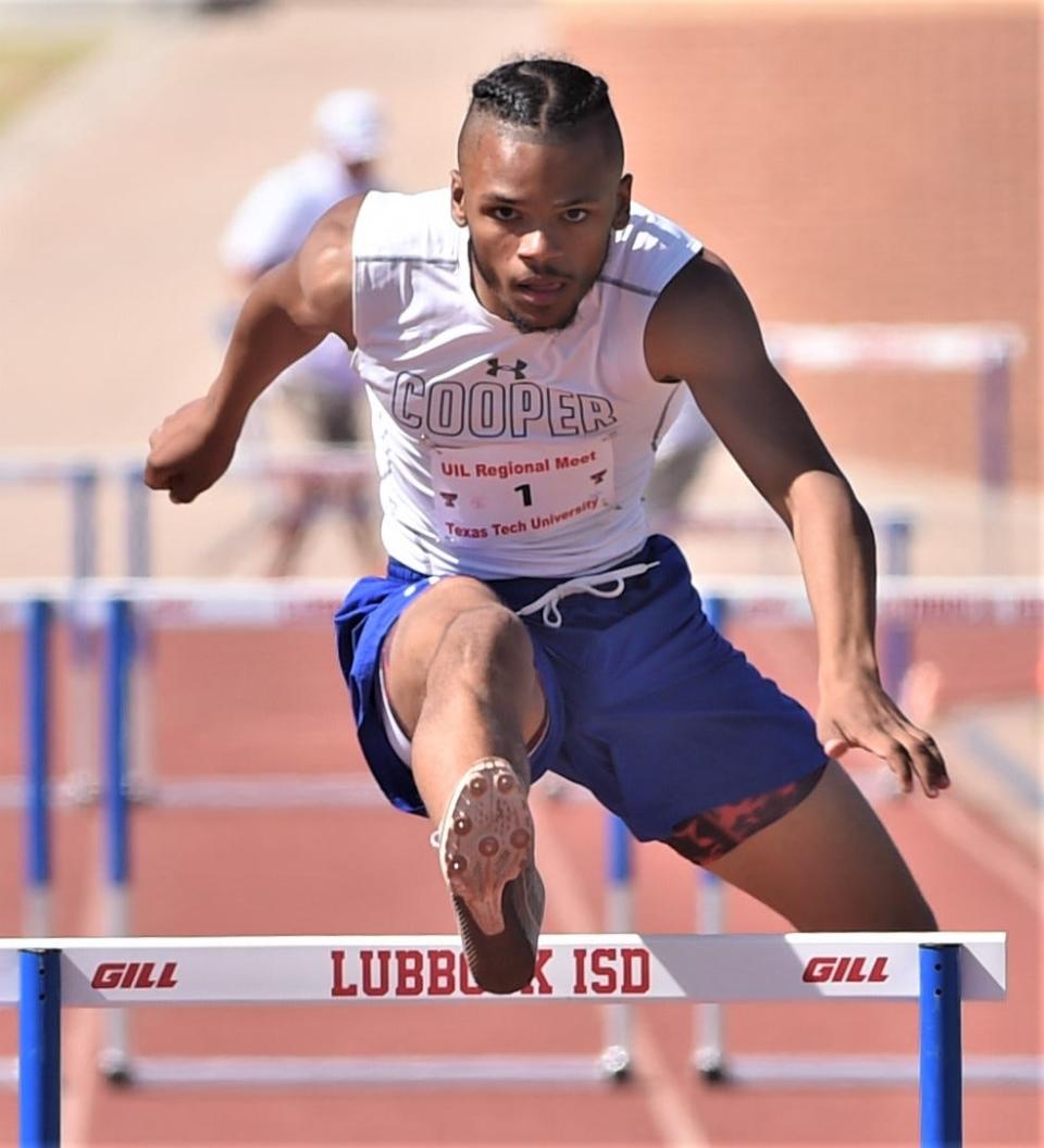 Cooper's Lawrence Diles competes in the 300 hurdles at the Region I-5A track and field meet Saturday at Lowrey Stadium in Lubbock. He finished sixth (40.81).