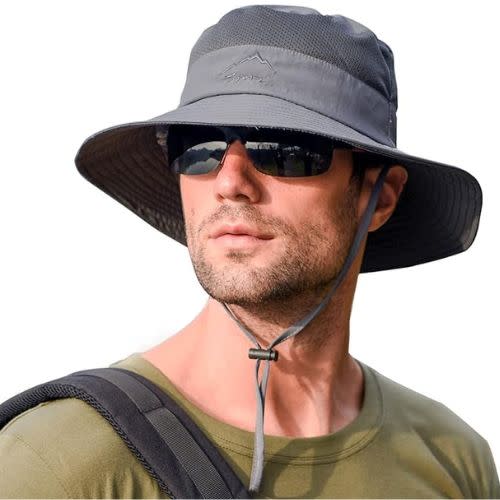 model wearing gray sun protective bucket hat