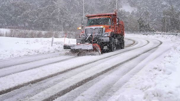 PHOTO: A plow clears snow on Mount Baldy Road in the town of Mount Baldy, Calif., on Feb. 24, 2023. (Allison Dinner/AFP via Getty Images)