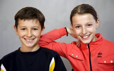 Twins Sara (R) and Davud Catic pose for a portrait in a primary school in Buzim April 10, 2015. REUTERS/Dado Ruvic