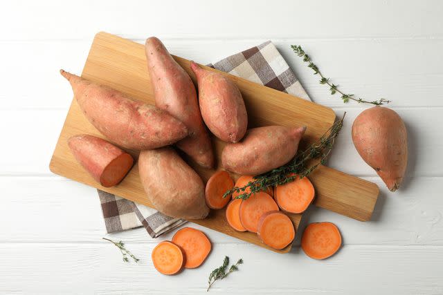 Orange-fleshed sweet potatoes are often sold as yams in grocery stores, but the two are different vegetables. PHOTO: GETTY IMAGES / ATLASSTUDIO