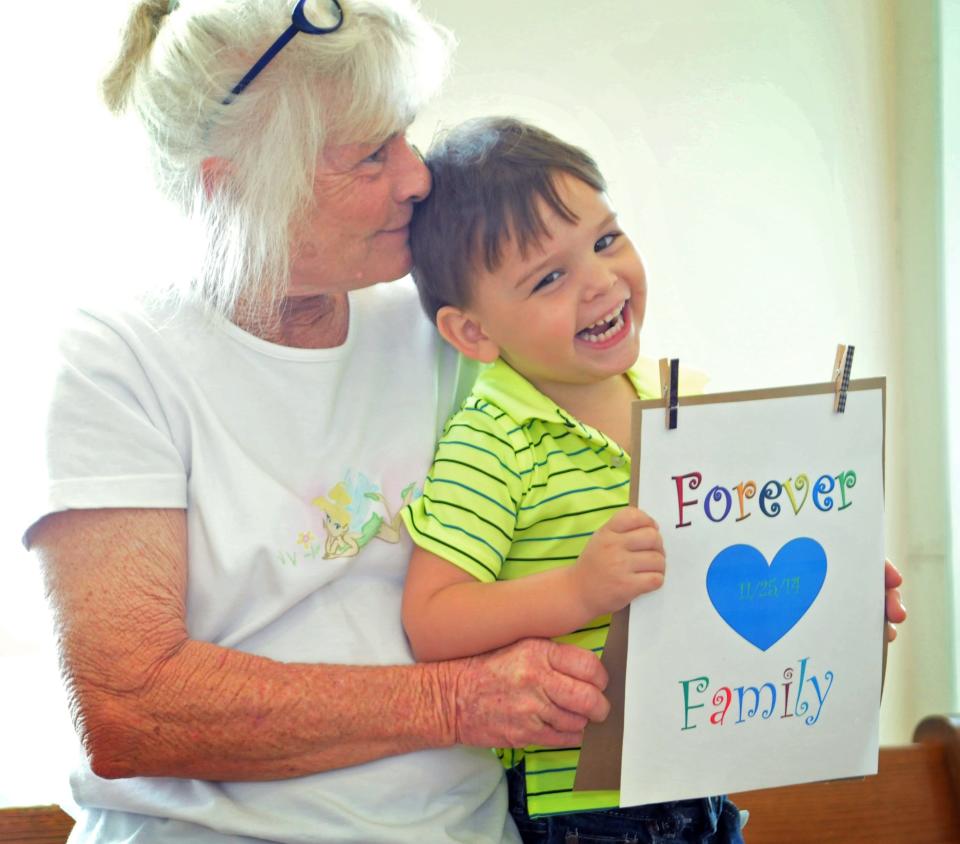 Pam Anders adopted her 2-year-old grandson, Riley Esquivel. Several children were adopted at a "Celebration of Adoption" event.