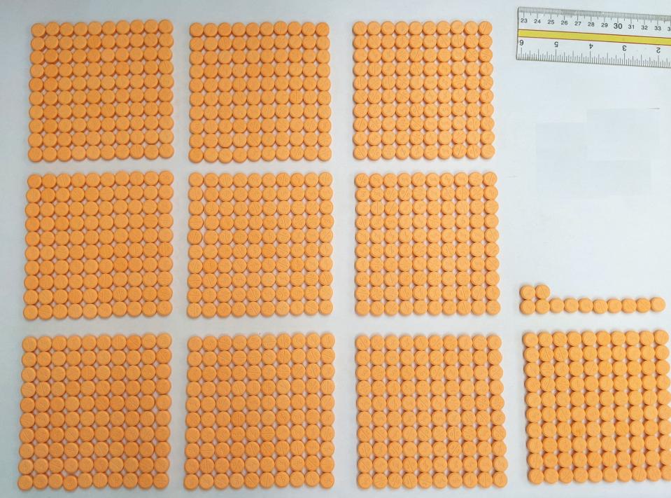 A photo taken by Laura Kimble, senior drug chemist and forensic scientist with the Hamilton County CoronerÕs Crime Laboratory, shows what was sold on the street as 30 mg of adderall, but actually contained methamphetamine. The pills were confiscated in a drug bust. The crime lab is located in Blue Ash.March 24, 2022