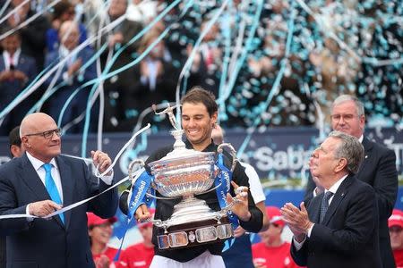 Tennis - Barcelona Open Final - Rafael Nadal of Spain v Dominic Thiem of Austria - Real Club de Tenis Barcelona, Spain - 30/04/17 - Rafael Nadal raises up the trophy. REUTERS/Albert Gea