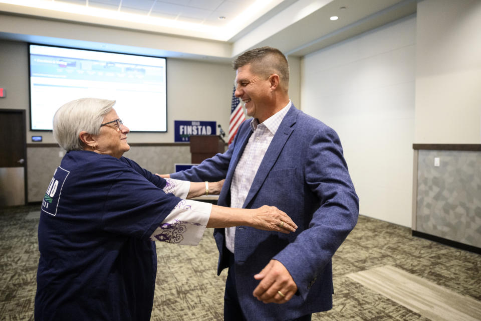 GOP congressional candidate Brad Finstad hugs his mother, Sharon Finstad, after Finstad gave a speech after during an election night party, Tuesday, Aug. 9, 2022, at the Sleepy Eye Event Center in Sleepy Eye, Minn. (Aaron Lavinsky/Star Tribune via AP)