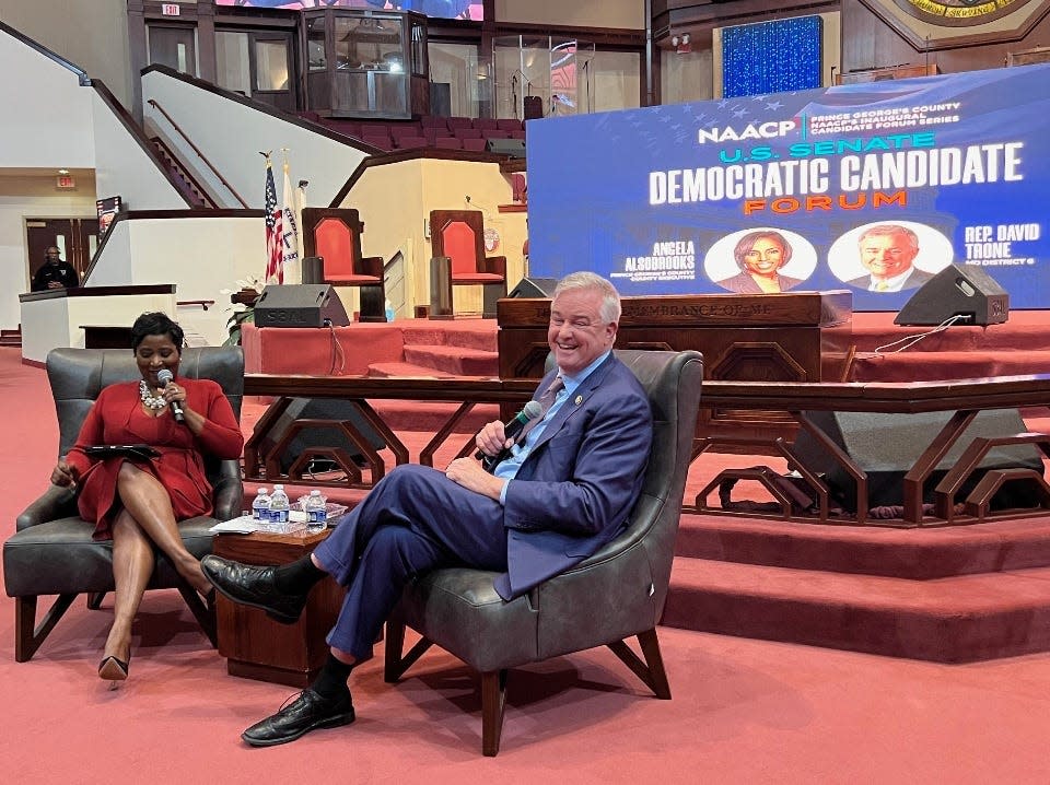 At right, U.S. Rep. David Trone, D-6th, smiles while a moderator and reporter Ebony McMorris, at left, readies another question during a U.S. Senate Democratic Candidate forum in Fort Washington, Maryland on March 8, 2024.