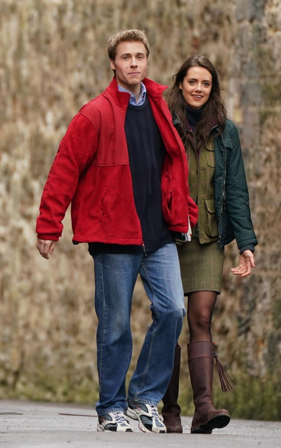 Ed McVey, as Prince William and actress Meg Bellamy, who plays Kate Middleton in between filming scenes - Andrew MIlligan/PA