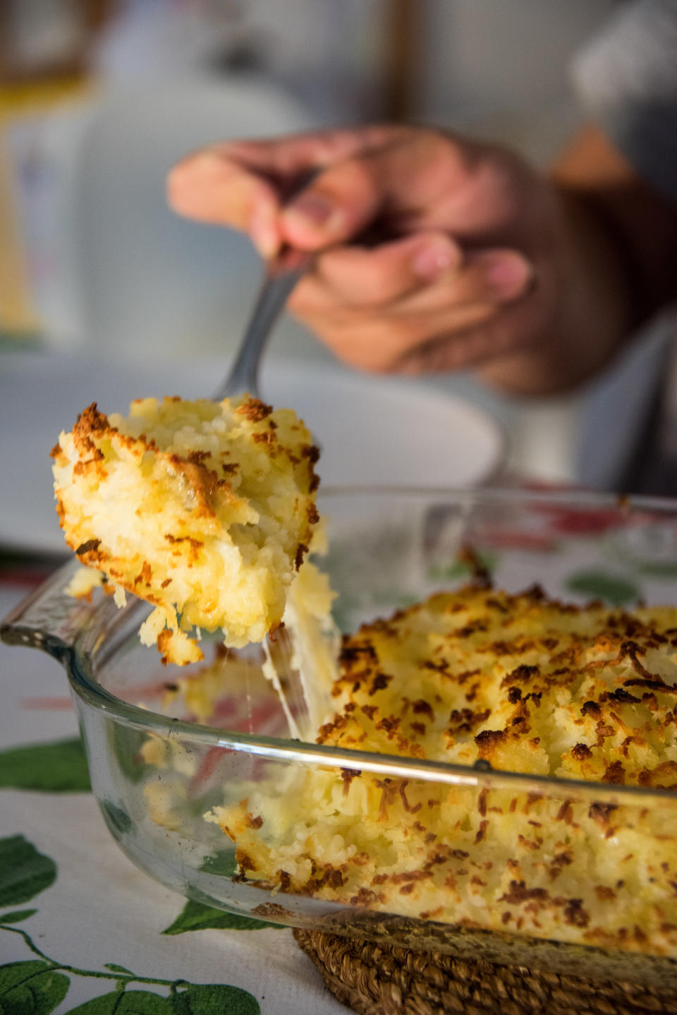 A casserole being cut into