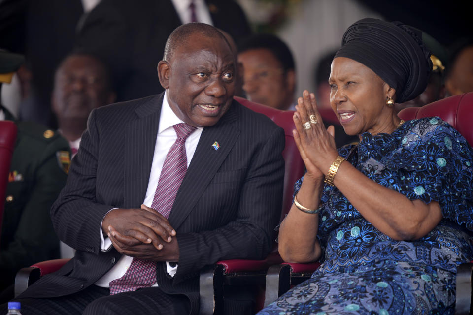 South African President Cyril Ramaphosa, left, talks to Zimbabwe's Defence Minister Oppah Muchinguri during Zimbabwean President Emmerson Mnangagwa's inauguration ceremony at the National Sports Stadium in the capital Harare, Monday, Sept. 4, 2023. Mnangagwa Monday hailed recent elections as a sign of the country’s “mature democracy” and a victory over Western adversaries, as he took an oath of office following polls whose credibility was questioned by multiple observer missions, including those from Africa. (AP Photo /Tsvangirayi Mukwazhi)