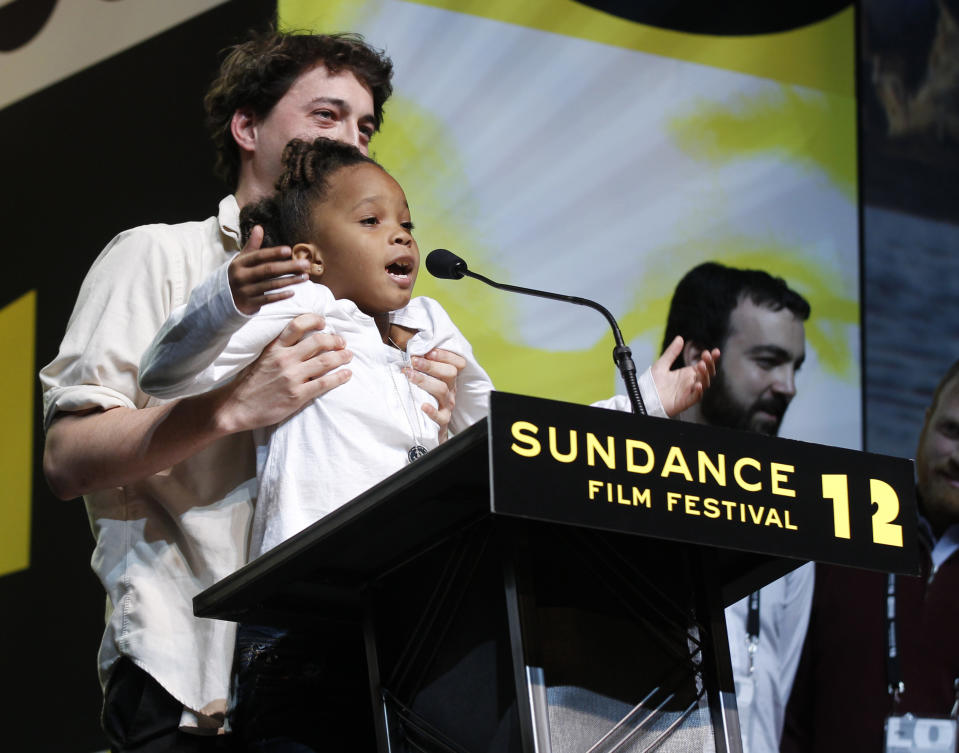 FILE - In this Jan. 28, 2012 file photo, Director Benh Zeitlin, left, holds up actress Quvenzhane Wallis as they accept the Grand Jury Prize U.S. Dramatic award for the film "Beasts of the Southern Wild" during the 2012 Sundance Film Festival Awards Ceremony in Park City, Utah. Last year's top Sundance prize winner, “Beasts of the Southern Wild,” picked up four Oscar nominations, including best picture, director for first-time filmmaker Benh Zeitlin and actress for 9-year-old Quvenzhane Wallis, who had never acted before. (AP Photo/Danny Moloshok, File)