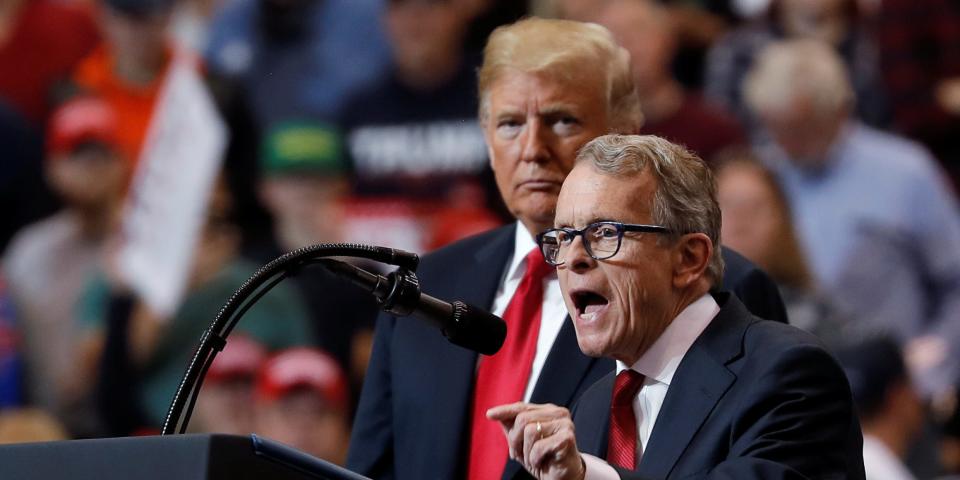 FILE PHOTO: U.S. President Donald Trump listens as Ohio gubernatorial nominee and Ohio Attorney General Mike Dewine speaks during a campaign rally in Cleveland, Ohio., U.S., November 5, 2018. REUTERS/Carlos Barria