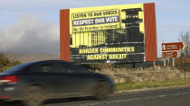 A motorist makes their way North along the old Belfast to Dublin road on the Irish border between Northern Ireland and the Irish Republic close to the town of Newry,, Northern Ireland, Thursday, Nov. 15, 2018. Brexit Secretary Dominic Raab and Work and Pensions Secretary Esther McVey sensationally walked out of the Government the morning after Cabinet agreed a draft EU withdrawal agreement in a stormy five-hour meeting. In his letter to the Prime Minister, Mr Raab said the deal represented a "very real threat to the integrity of the United Kingdom" because of provisions for Northern Ireland. He also said he could not accept "an indefinite backstop arrangement" for the Irish border. (AP Photo/Peter Morrison)