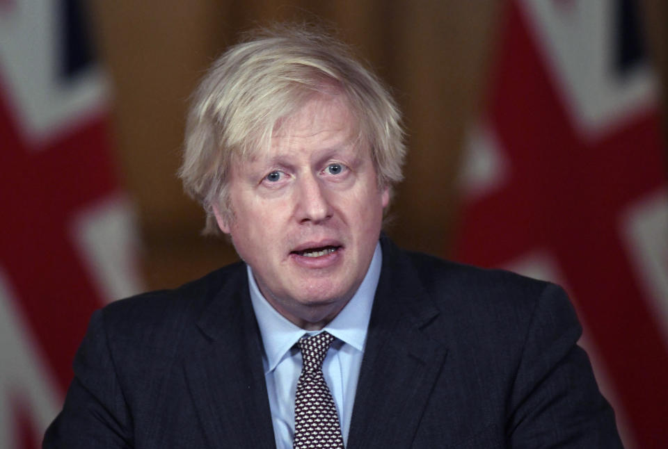 Britain's Prime Minister Boris Johnson speaks during a media briefing on coronavirus in Downing Street, London, Wednesday, Feb. 3, 2021. (Stefan Rousseau/Pool Photo via AP)