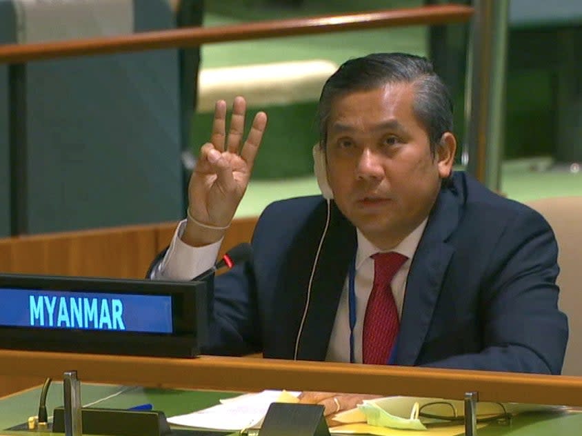 <p>Myanmar’s ambassador to the United Nations Kyaw Moe Tun holds up three fingers at the end of his address</p> (Reuters)