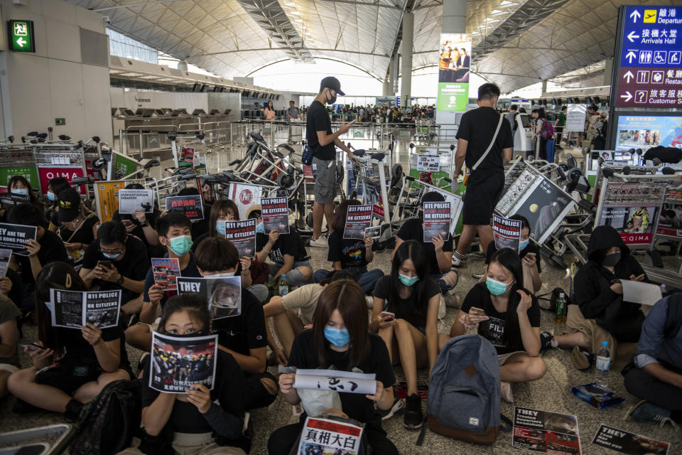 Protester are seen sitting in the ground of Hong Kong International Airport in Hong Kong on August 13, 2019. (Photo: Vernon Yuen/NurPhoto via Getty Images)