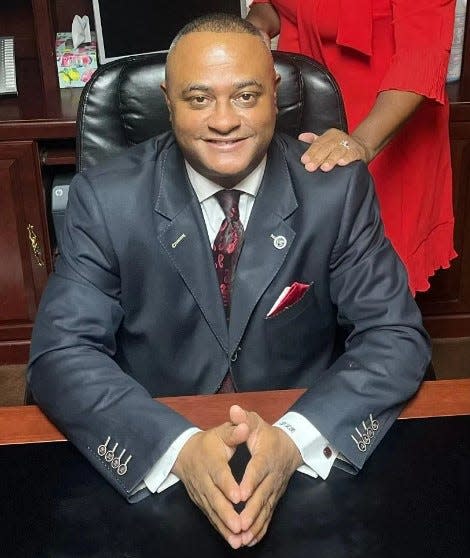 Pastor Daimon Rawlinson, as pictured on the church's website, is being sued by members of his own church.