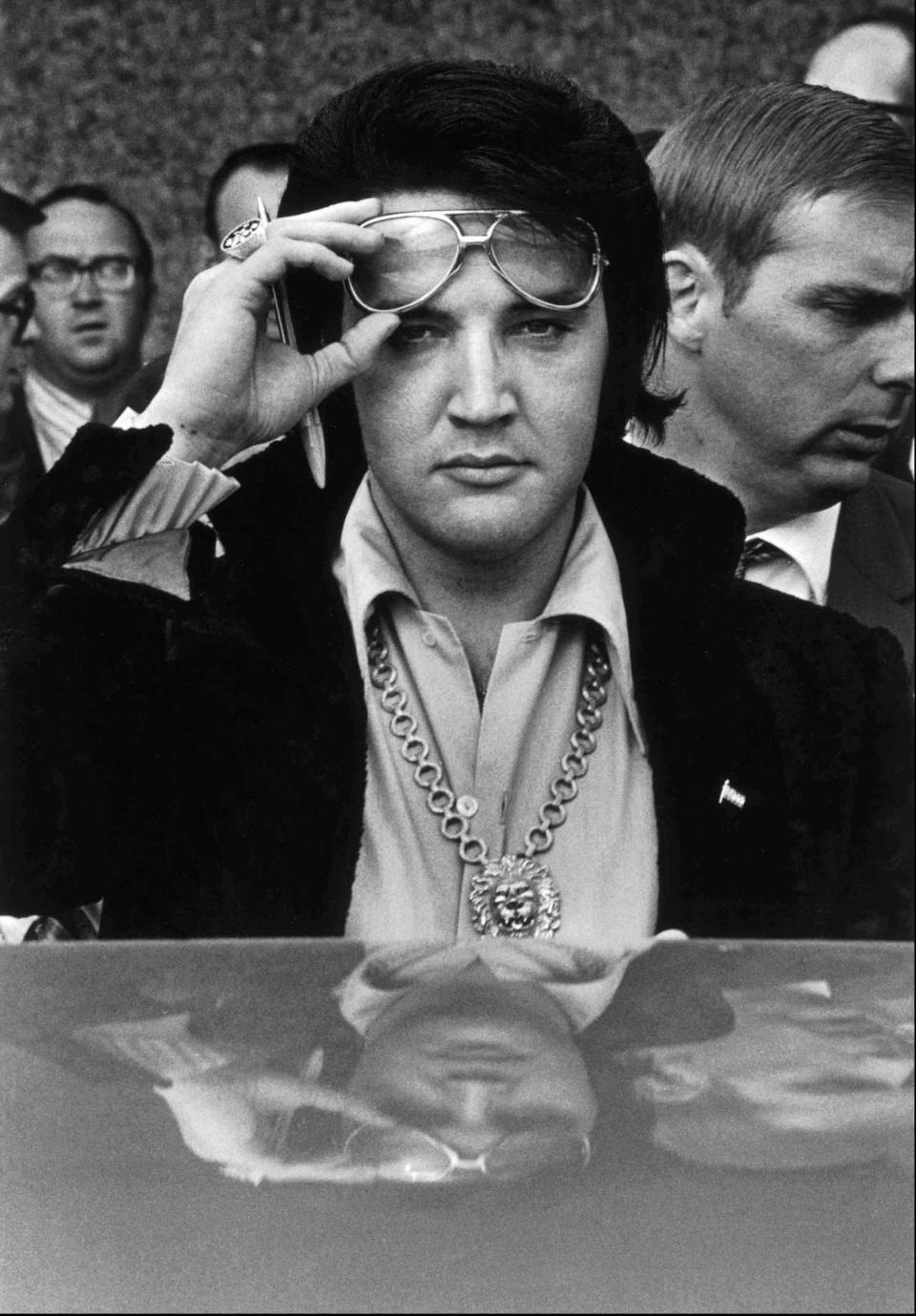 Jan. 16, 1971: Elvis Presley is reflected in the roof of his automobile as he looks into the camera after attending a luncheon at what was then the Holiday Inn Rivermont. Elvis would have turned 88 on Jan. 8 this year.