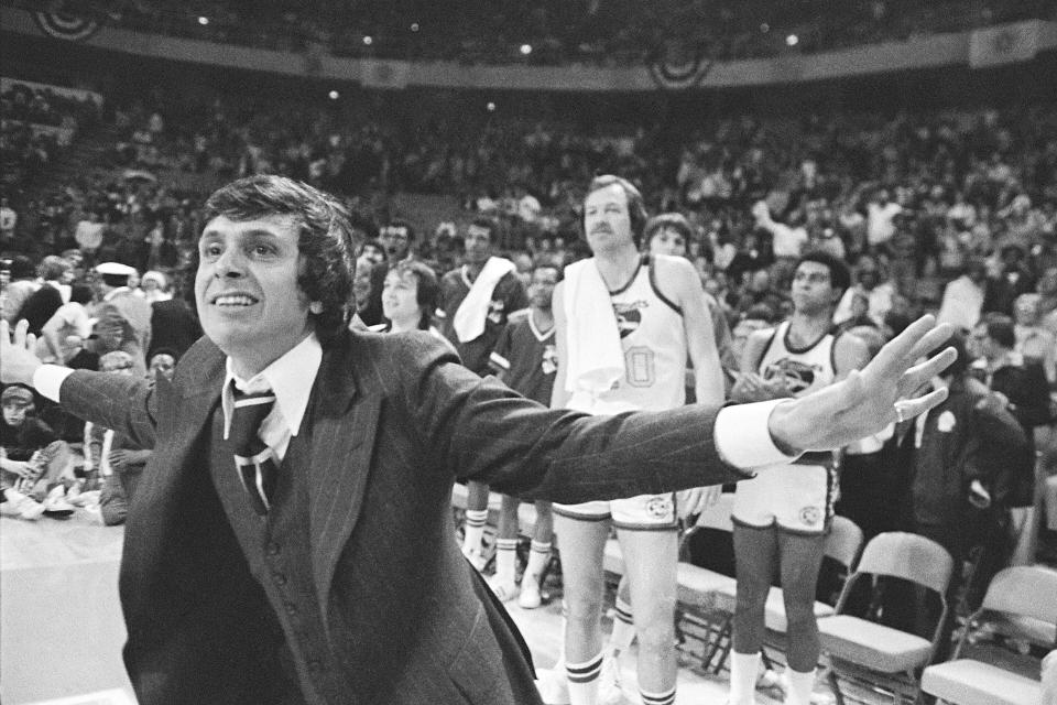 FILE - Denver Nuggets head coach Larry Brown leaps off the bench at the buzzer after his Nuggets defeated the American Basketball Association All-Stars in Denver on Jan. 28, 1976. Now, with the Nuggets the top-seed in the Western Conference, Denver has never seemed to be mistaken for much beyond an NBA novelty. And if there really is gold at the end of all those rainbows, a real Nuggets fan will have to see it to believe it. (AP Photo/SC, File)