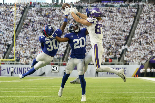 MINNEAPOLIS, MN - DECEMBER 24: New York Giants cornerback Cordale Flott (28)  celebrates an intercept