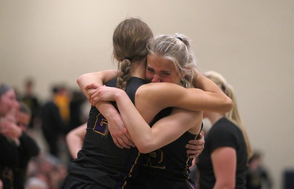 OLSH's Claudia Ierullo (22) is consoled by McKinley Walsh (2) after OLSH falls to River Valley 44-38 in the PIAA 3A Semifinals game Monday night at Kiski Area High School in Leechburg, PA.