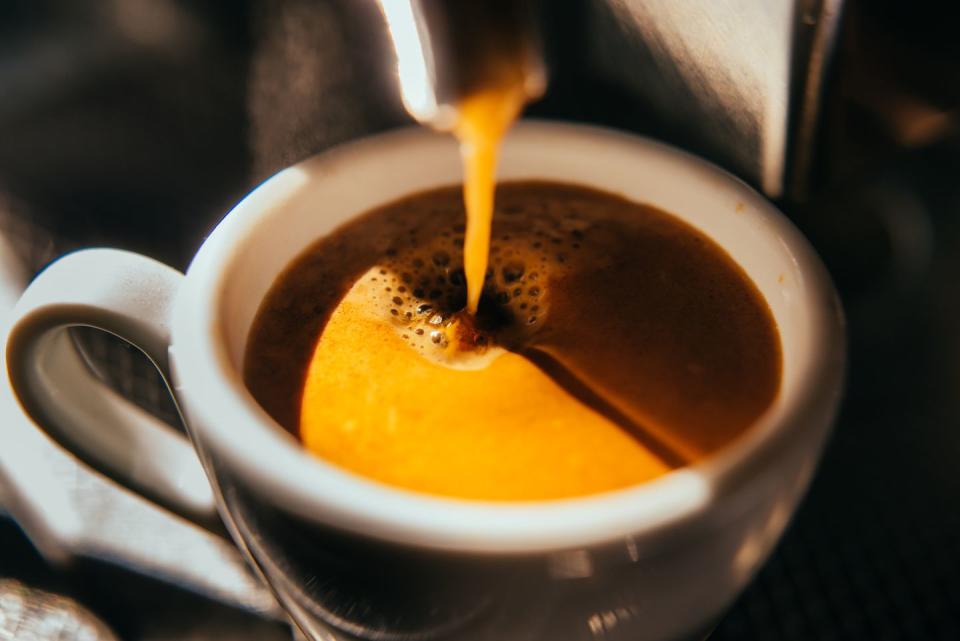 coffee machine pouring out espresso shot