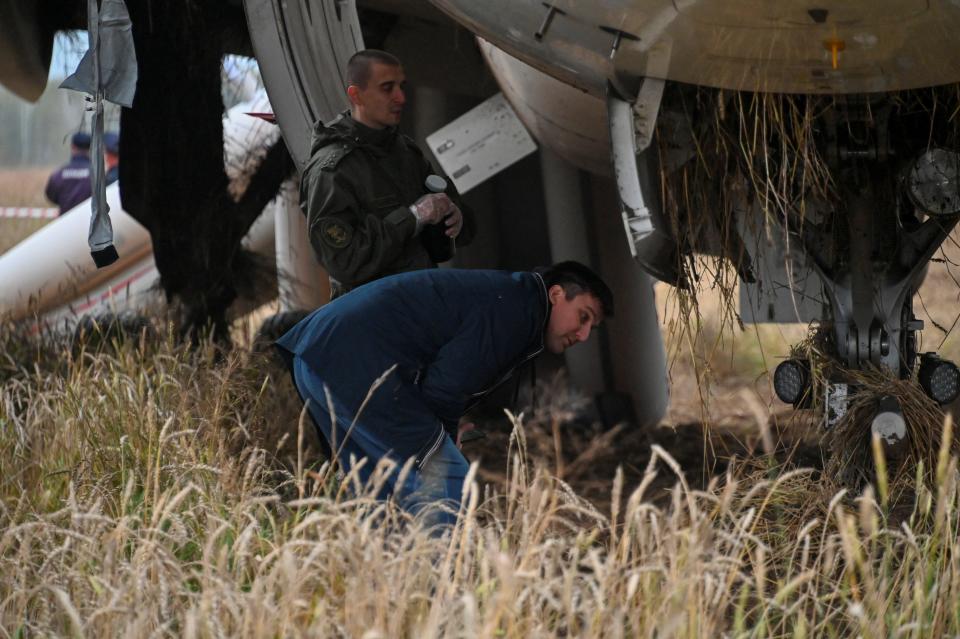 Workers inspecting the A320 jet in Siberia.