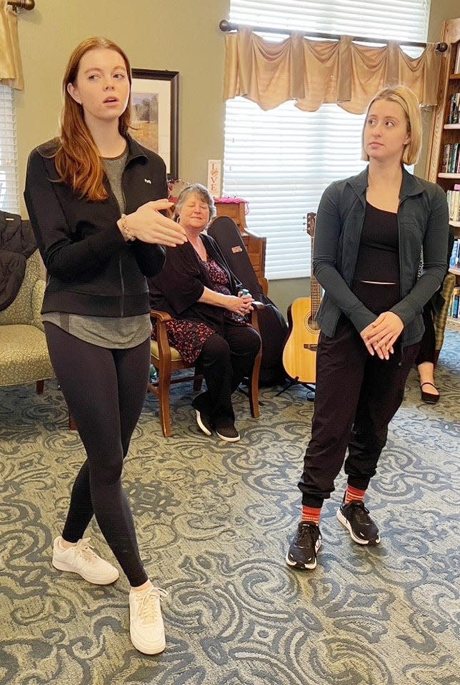 Caroline Purdy, left, and Cara Torchia, both actors with the recent "Hairspray" production that came to IU Auditorium, sing and perform at Bloomington's Brookdale Senior Living center as part of an IU Auditorium program that's offering programs in the community. Music therapist Valerie Jones watches.