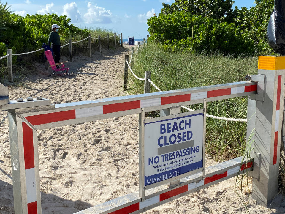 A sign announces beach closure to prevent the spread of the coronavirus ahead of the Fourth of July weekend in Miami Beach, Florida.  (Photo: REUTERS/Elizabeth Feria)