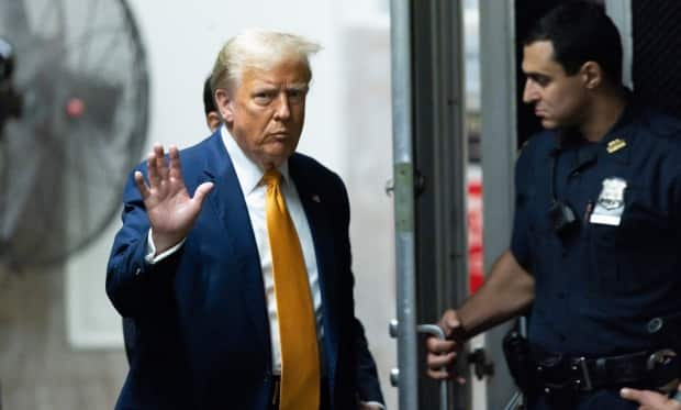 Former U.S. president Donald Trump returns to the courtroom after a break in his criminal trial at Manhattan criminal court before his trial in New York, on May 14. 