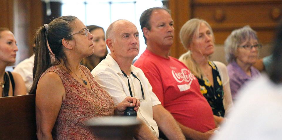 Family and friends of Cameron Nohmy listen to the start of the trial of Alyssa Dellamano in Dedham Superior Court on Thursday, July 27, 2023. She is accused of killing Nohmy, 24, of Milton, in Quincy in 2020.