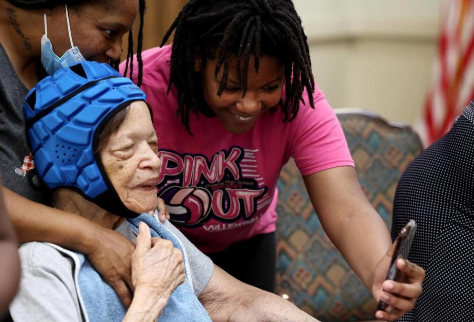 Lake Como Juneteenth pageant contestant contestant Aaliyah Henderson, 12, FaceTimes with family members Darling Webster, 86, center, and Tracy Mason while visiting the West Side Campus of Care on Wednesday, June 14, 2023.