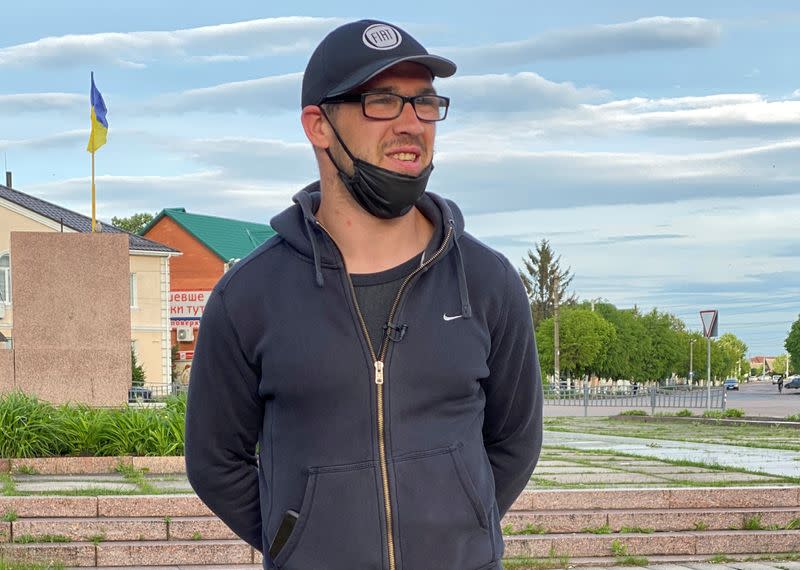 Ukrainian worker Diachenko speaks during an interview in Chernyakhiv