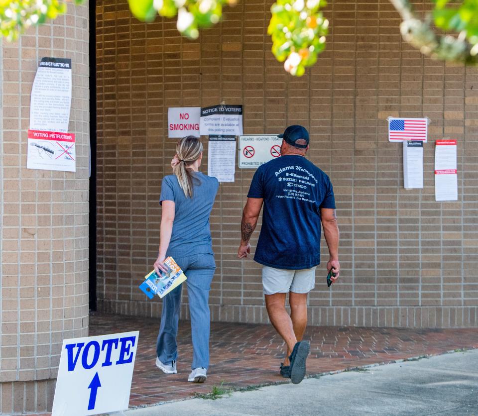 Voters arrive Tuesday at the Coliseum Boulevard Library voting precinct in Montgomery.