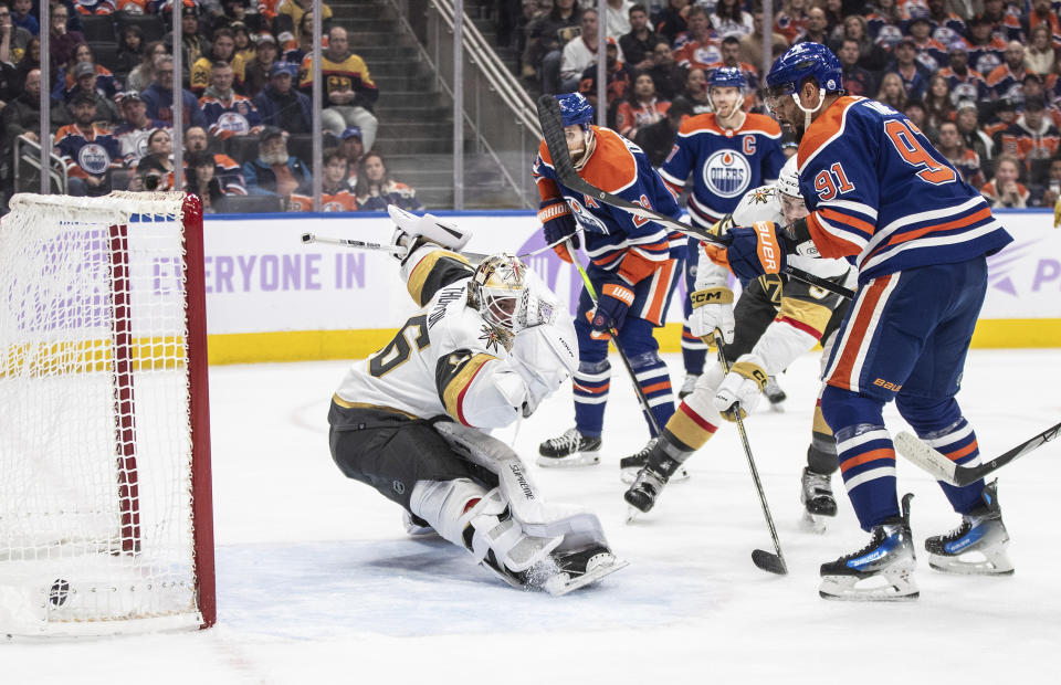 Vegas Golden Knights goalie Logan Thompson (36) is scored on by Edmonton Oilers' Evander Kane (91) during the second period of an NHL hockey game in Edmonton, Alberta on Tuesday Nov. 28, 2023. (Jason Franson/The Canadian Press via AP)