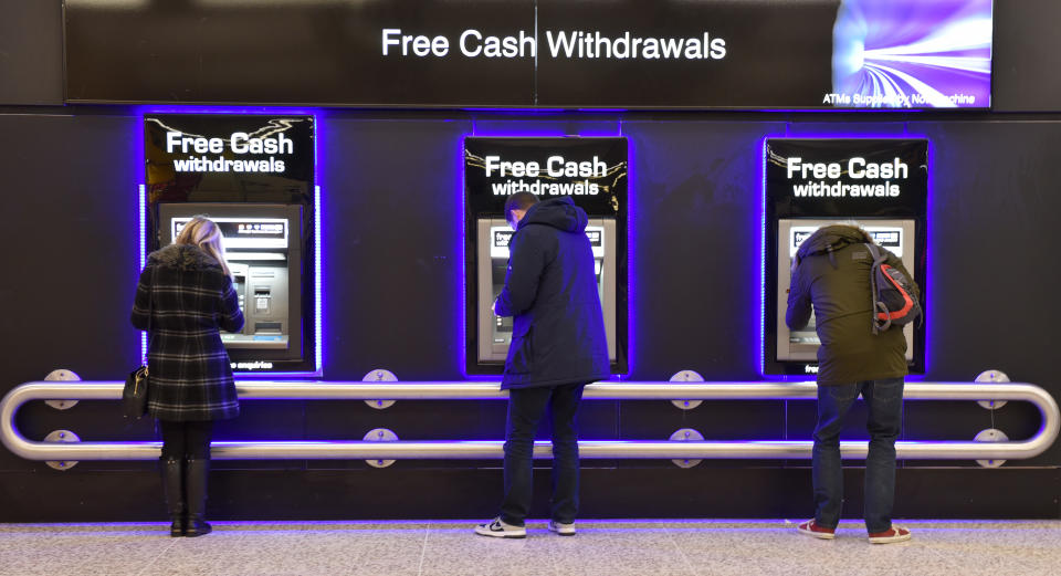 LONDON, ENGLAND - DECEMBER 16: People withdraw cash from free ATM cash machines on December 16, 2017 in London, England. (Photo by John Keeble/Getty Images)