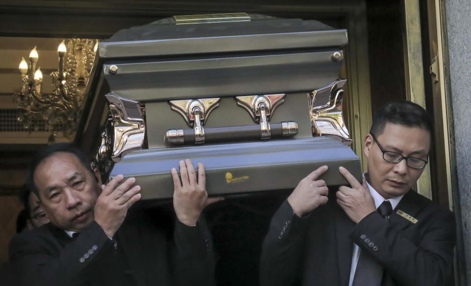 REMOVES REFERENCE TO HOMELESS KILLED - Pallbearers carry the casket of Chuen Kok from the Ng Fook Funeral Home, Friday Oct. 18, 2019, in New York. Kok, an 83-year-old homeless man whom Chinatown residents warmly greeted as "uncle," was one of four men bludgeoned to death in the community last week. (AP Photo/Bebeto Matthews)