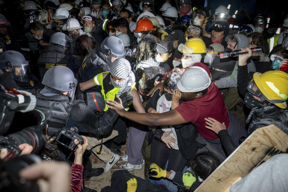 FILE - Police advance on pro-Palestinian demonstrators on the UCLA campus Thursday, May 2, 2024, in Los Angeles. (AP Photo/Ethan Swope, File)