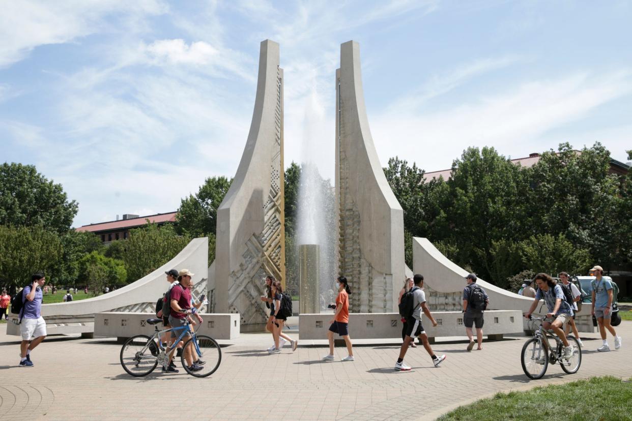 Students walk across Purdue University's campus, Monday, Aug. 23, 2021 in West Lafayette.