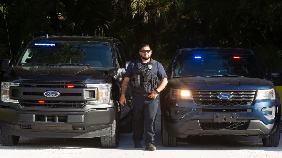 Officers with the North Port Police Department secure the entrance to Myakkahatchee Creek Environmental Park on October 20, 2021, in North Port, Florida. Human remains and personal items belonging to Brian Laundrie had been found there, officials said. - Mark Taylor/Getty Images