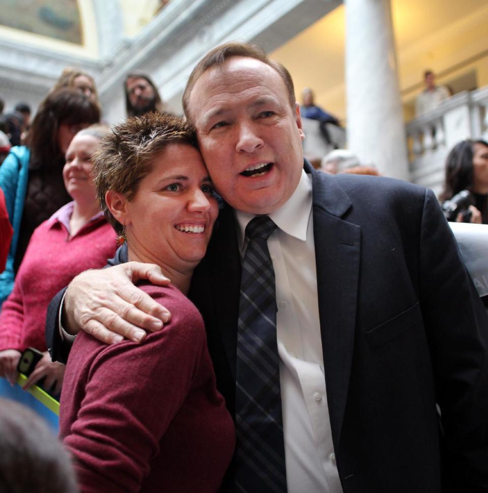 Openly gay Utah state democratic senator Jim Dabakis hugs Cathy Croft during a rally in support of gay marriage at the Utah State Capitol Friday Jan. 10, 2014 in Salt Lake City. Supporters of gay marriage fill the rotunda as they gathered to rally and deliver a petition with over 58,000 signatures in support of gay marriage to Utah Governor Gary Herbert. (AP Photo/Steve C. Wilson)