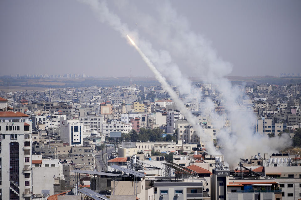 Rockets are launched from the Gaza Strip towards Israel, in Gaza, Wednesday, May 10, 2023. Palestinian militants fired dozens of rockets from the Gaza Strip into Israel on Wednesday, in a first response to Israeli airstrikes that have killed 16 Palestinians, including three senior militants and at least 10 civilians. (AP Photo/Hatem Moussa)