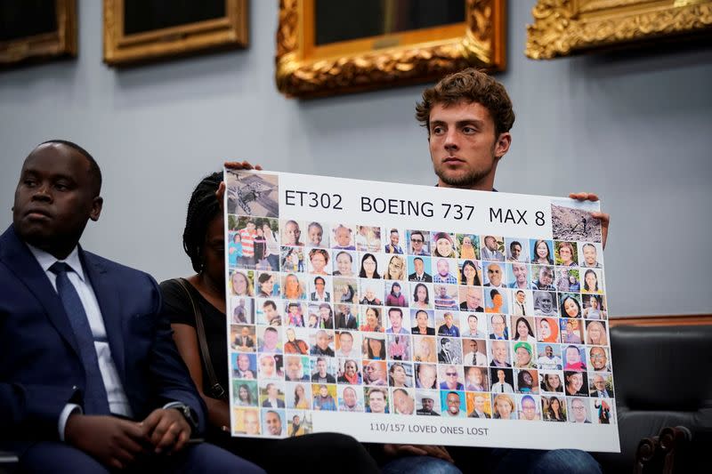 FILE PHOTO: Adnaan Stumo, who lost his sister Samya Rose Stumo in the Ethiopian Airlines Flight 302 crash hold a poster during a House Appropriations subcommittee hearing on aviation certifications, on Capitol Hill in Washington