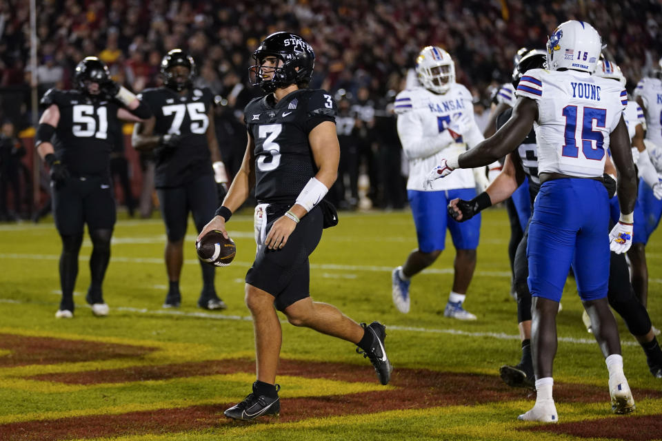 Iowa State quarterback Rocco Becht (3) scores on a 2-yard touchdown run during the second half of an NCAA college football game against Kansas, Saturday, Nov. 4, 2023, in Ames, Iowa. Kansas won 28-21. (AP Photo/Charlie Neibergall)