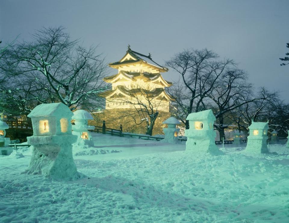 castle lit up for a Japan snow festival 