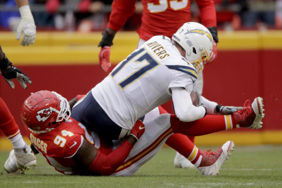 Kansas City Chiefs defensive end Terrell Suggs (94) sacks Los Angeles Chargers quarterback Philip Rivers (17) during the second half of an NFL football game in Kansas City, Mo., Sunday, Dec. 29, 2019. (AP Photo/Charlie Riedel)