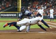 Jun 19, 2018; Houston, TX, USA; Houston Astros right fielder George Springer (4) attempts to slide around the tag of Tampa Bay Rays catcher Wilson Ramos (40) during the first inning at Minute Maid Park. Mandatory Credit: Troy Taormina-USA TODAY Sports