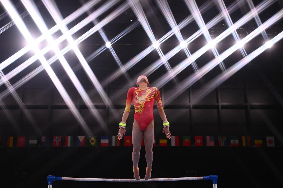 <p>TOPSHOT - China's Xijing Tang competes in the uneven bars event of the artistic gymnastics women's team final during the Tokyo 2020 Olympic Games at the Ariake Gymnastics Centre in Tokyo on July 27, 2021. (Photo by Loic VENANCE / AFP) (Photo by LOIC VENANCE/AFP via Getty Images)</p> 